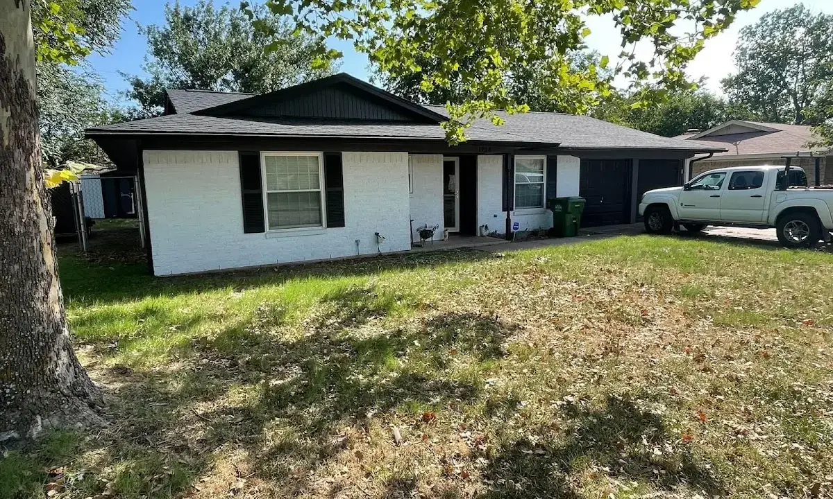 Professional roofing crew working on a residential roof in Poquoson